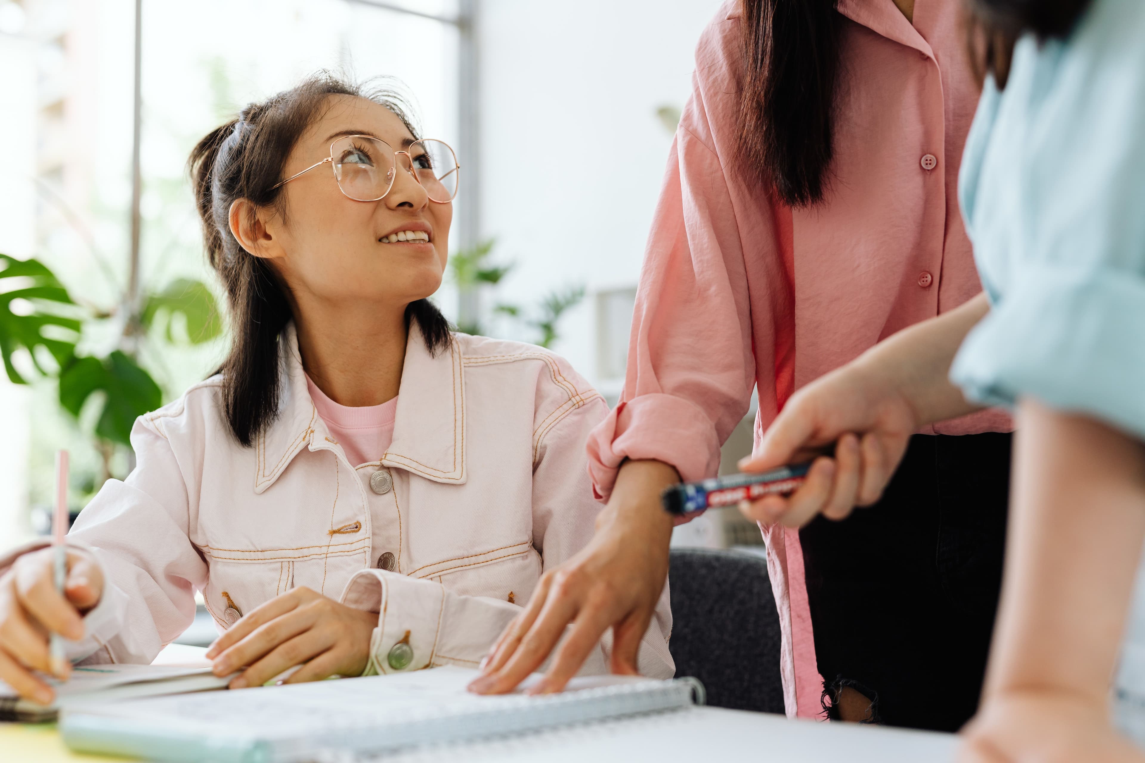 Asian professional team collaborating in a modern office